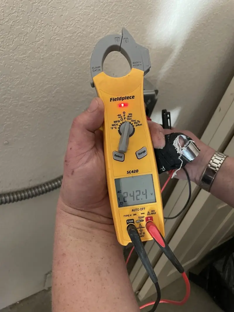 Voltage testing with clamp meter during Circuit Breaker Repair in Hopkins